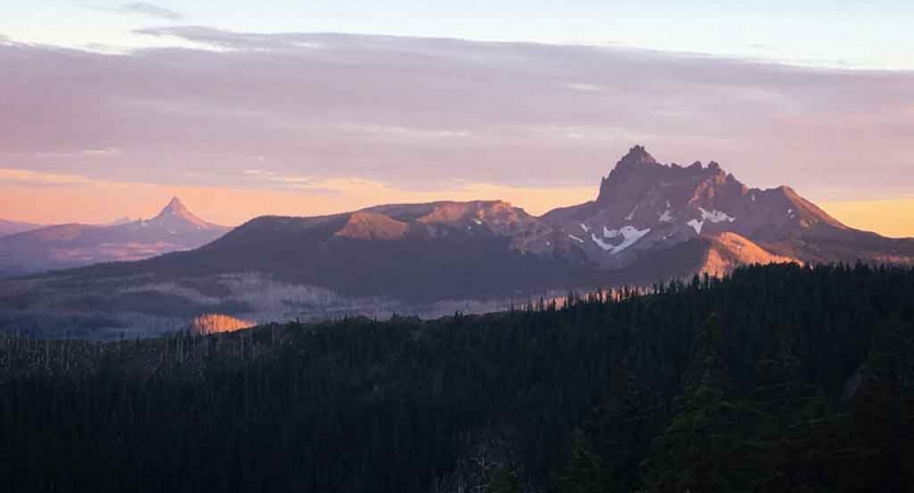 a mountain range at either sunrise or sunset